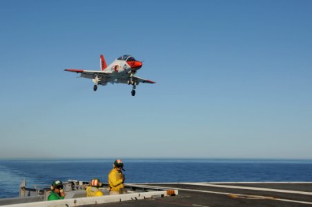 US Navy 101104-N-3327M-467 A T-45 Goshawk training aircraft lands aboard the aircraft carrier USS Nimitz (CVN 68) during training wing carrier qual