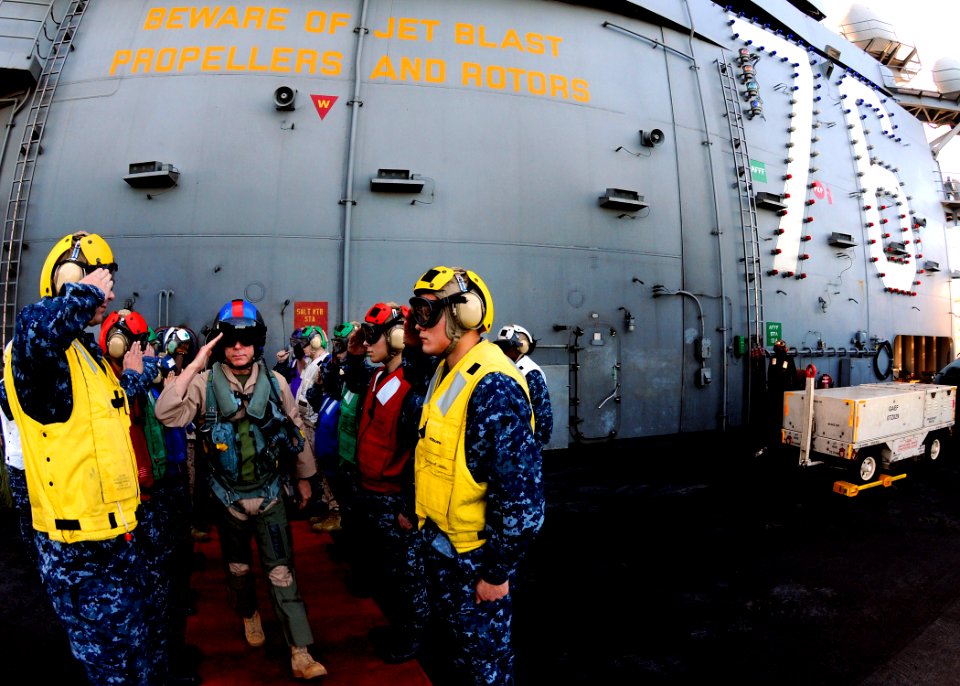 US Navy 101105-N-1004S-069 Commandant of the Marine Corps Gen. James Amos departs through rainbow side boys aboard the aircraft carrier USS Ronald