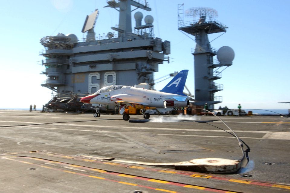 US Navy 101105-N-3327M-053 A T-45C Goshawk training aircraft lands aboard the aircraft carrier USS Nimitz (CVN 68) during training wing carrier qua