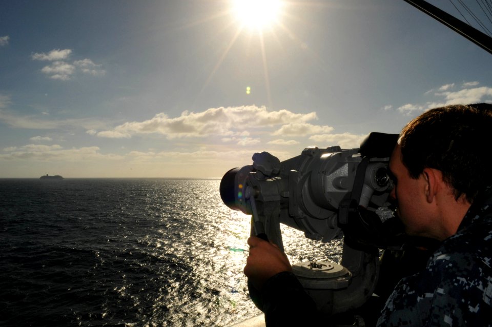 US Navy 101109-N-1004S-052 Aerographer's Mate 2nd Class David W. Mullis gets a closer look at the Carnival cruise ship C-V Splendor from aboard the