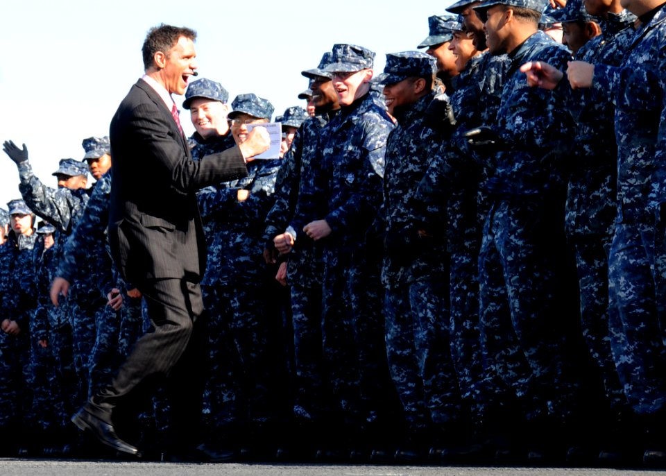 US Navy 101108-N-6632S-061 Jay Crawford, left, one of the hosts of the ESPN2 television show, ESPN First Take, cheers with Sailors assigned to the