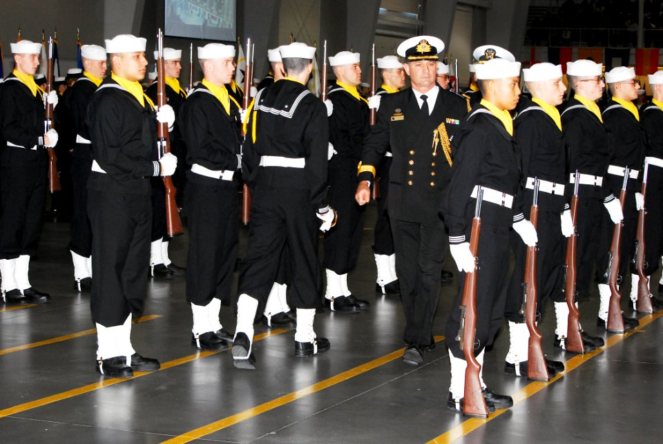 US Navy 101105-N-7042S-002 Commodore Stephen P. Woodall, Royal Australian Naval Attache, inspects the drill team during a graduation ceremony at Re