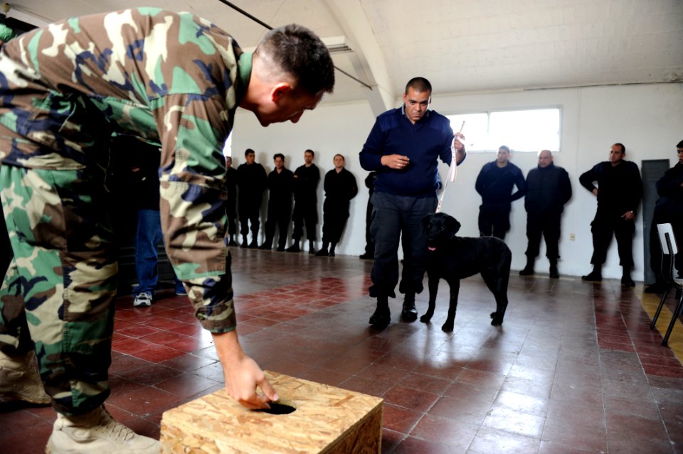 US Navy 101108-N-8546L-875 Chief Master-at-Arms Nick Estrada, left, a U.S. Navy military working dog handler from Orange, Calif