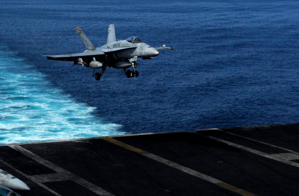 US Navy 101106-N-6427M-036 An F-A-18C Super Hornet assigned to the Checkerboards of Marine Fighter Attack Squadron (VMFA) 312 lands aboard the airc