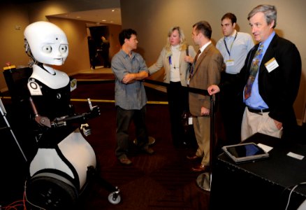 US Navy 101109-N-7676W-127 Greg Trafton, center, a cognitive scientist with the Naval Research Laboratory, discusses Octavia, left,