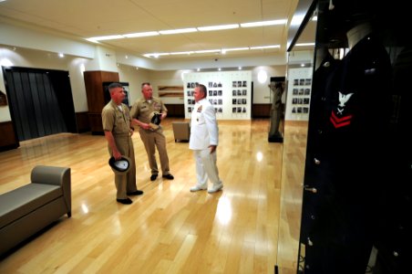 US Navy 101109-N-7367K-008 Master Chief Jimmy Fairbanks, right, the ombudsman for the Armed Forces Retirement Home, gives a tour of the center to M photo