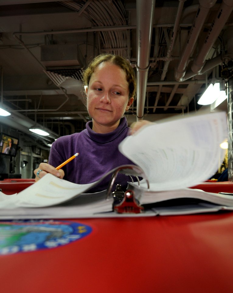 US Navy 101106-N-9132C-096 Aviation Boatswain's Mate (Fuel) Airman Jessica Franklin, from Surfside, Minn., studies for a math test in the aft mess