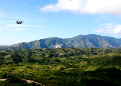 US Navy 101106-M-6740B-112 A CH-46E Sea Knight helicopter onducts aerial damage assessments of Haiti after Hurricane Tomas made landfall