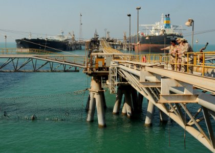 US Navy 101110-N-5016P-132 Rear Adm. Mark D. Guadagnini, commander of the Abraham Lincoln Carrier Strike Group, tours the Al Basra Oil Terminal