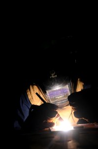 US Navy 101106-N-7939W-085 Hull Technician 3rd Class Jerod Baillargeon, from Everson, Wa. makes an aluminum bracket aboard the aircraft carrier USS