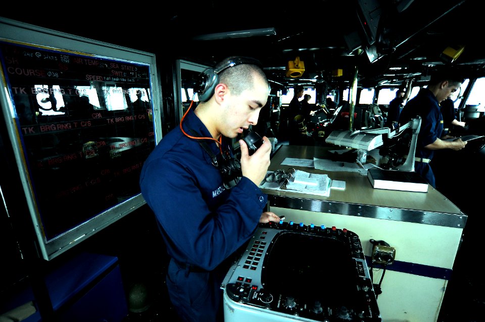 US Navy 101109-N-8335D-416 Operations Specialist Seaman Chris Marcial mans the radar station on the bridge of the amphibious dock landing ship USS