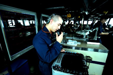 US Navy 101109-N-8335D-416 Operations Specialist Seaman Chris Marcial mans the radar station on the bridge of the amphibious dock landing ship USS photo