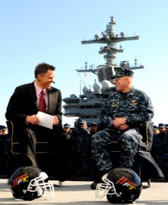 US Navy 101108-N-3885H-077 Jay Crawford, left, one of the hosts of the ESPN2 television show, ESPN First Take, speaks with Capt. Chip Miller, comma