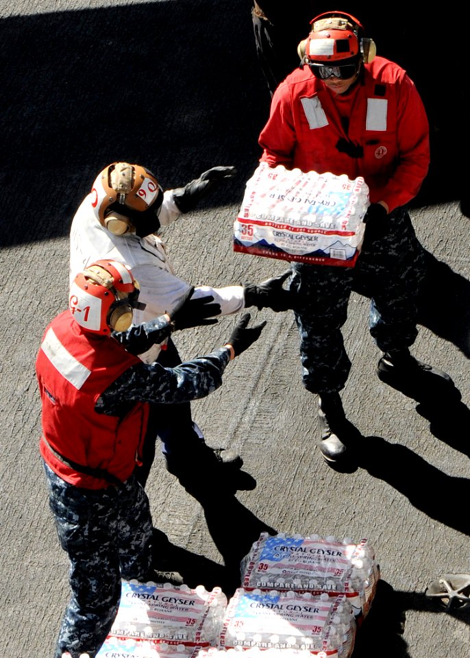 US Navy 101109-N-1004S-192 Sailors assigned to the aircraft carrier USS Ronald Reagan (CVN 76) and embarked Carrier Air Wing 14 form a daisy chain
