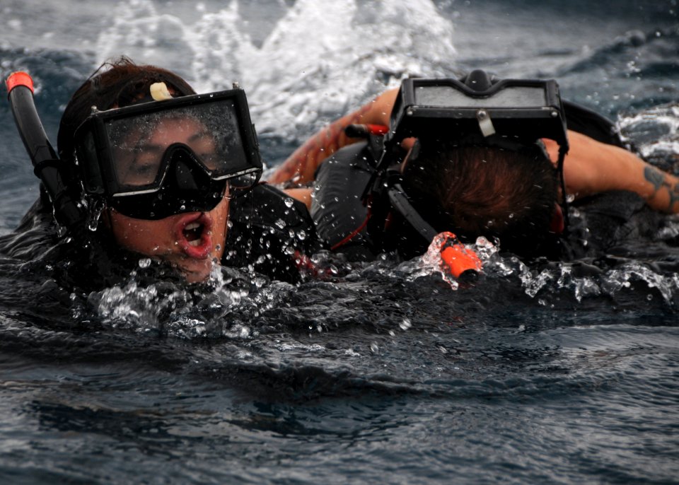 US Navy 101108-N-0120A-134 Fire Controlman 3rd Class Shana Oltman uses the cross-chest carry rescue technique to transport Damage Controlman 3rd Cl