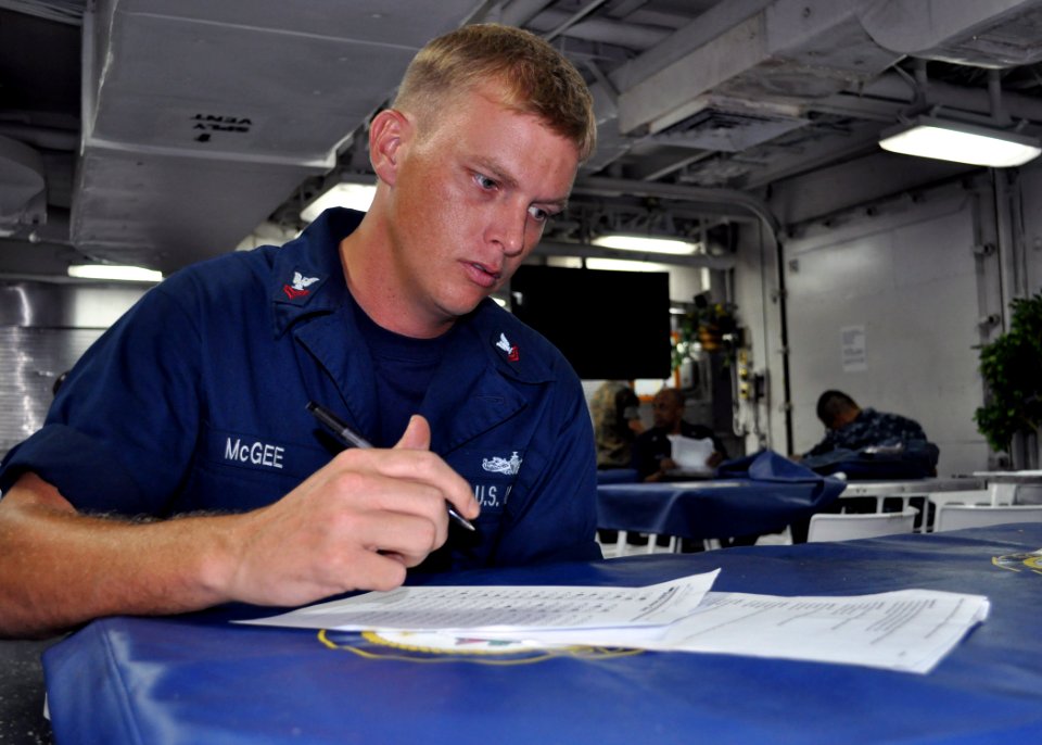 US Navy 101109-N-3620B-022 Boatswain's Mate 2nd Class Kerry McGee takes a medical level-of-knowledge examination aboard the amphibious transport do