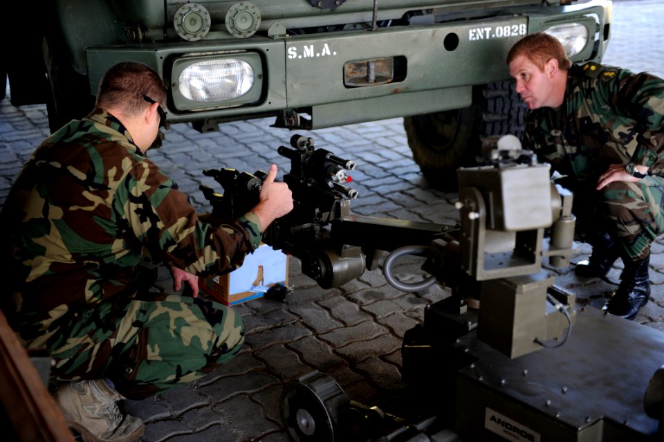 US Navy 101112-N-8546L-418 Senior Chief Explosive Ordnance Disposal (EOD) Technician Jonathan C. Bates, left, a master EOD technician from Kennewic