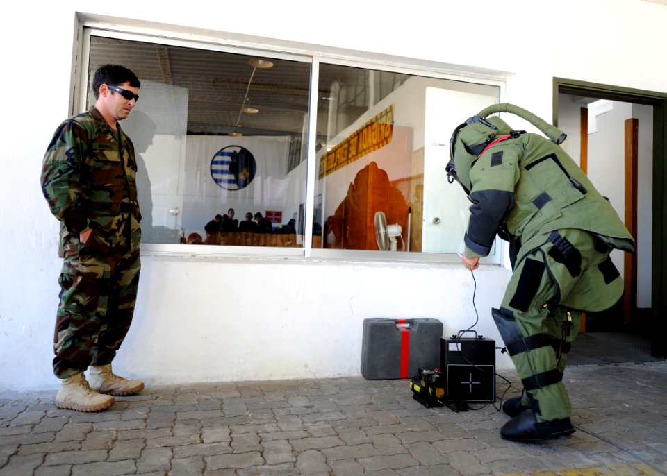US Navy 101112-N-8546L-078 Senior Chief Explosive Ordnance Disposal Technician Chad L. Harris, left, a master explosive ordnance disposal technicia