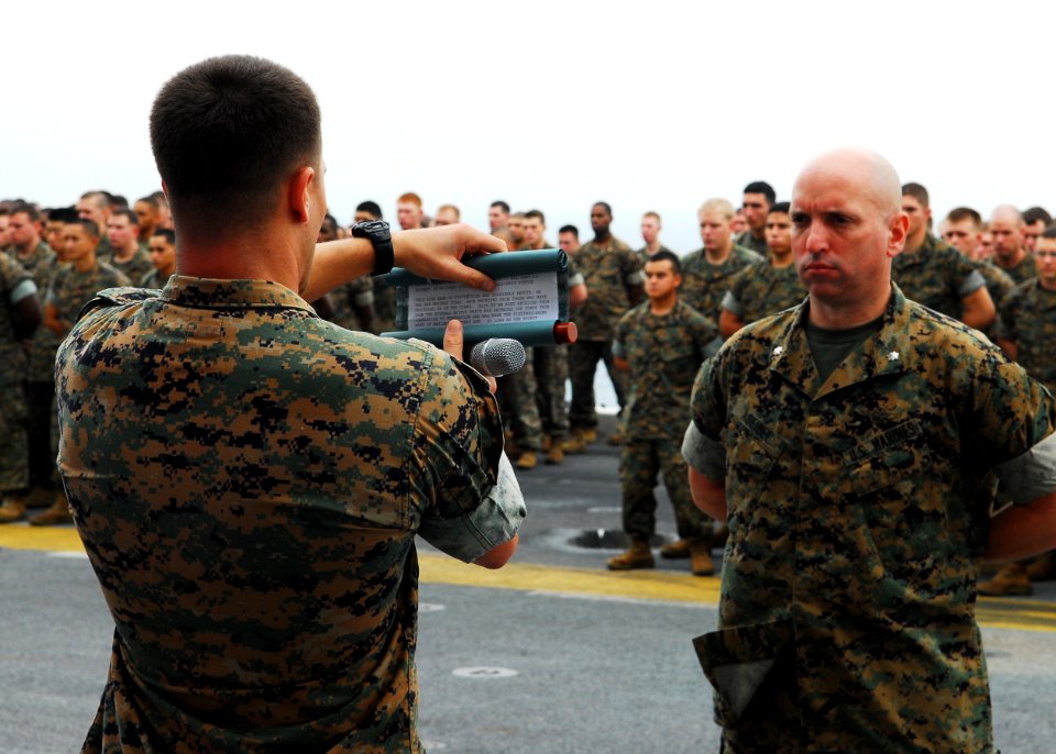 US Navy 101110-N-2218S-023 A Marine assigned to the 31st Marine Expeditionary Unit (31st MEU) reads a message from Lt. Gen. John Lejeune