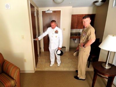 US Navy 101109-N-7367K-019 Master Chief Jimmy Fairbanks, left, the ombudsman for the Armed Forces Retirement Home, gives a tour of the center to Ma