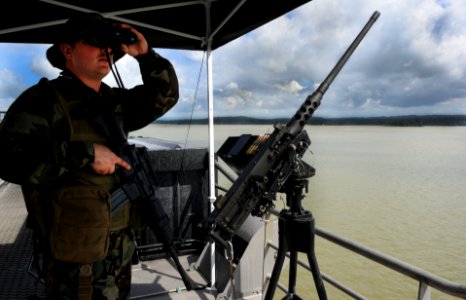 US Navy 101111-N-7589W-109 Master-at-Arms Seaman Gregory Seigmund stands aft watch aboard High Speed Vessel Swift (HSV 2) during its transit throu