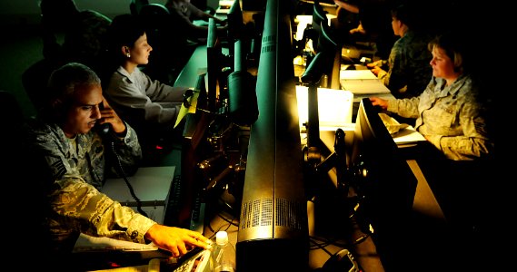 US Navy 101109-N-7498L-132 Representatives at the Joint Base Pearl Harbor-Hickam Emergency Operation Center coordinate activities and information d