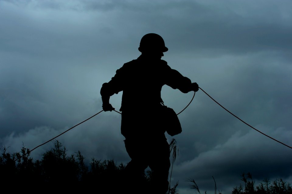 US Navy 101115-N-8546L-069 A Uruguayan explosive ordnance disposal technician maneuvers a line attached to an improvised explosive device during a