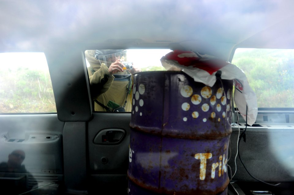 US Navy 101115-N-8546L-532 A Uruguayan explosive ordnance disposal technician collects photographic reconnaissance information of a vehicle born im