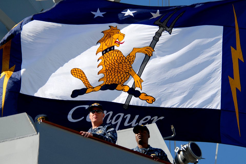 US Navy 101112-N-3737T-210 Cmdr. Douglas Kunzman, left, commanding officer of the guided-missile destroyer Pre-Commissioning Unit (PCU) Gravely (DD