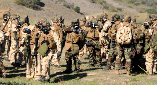 US Navy 101116-N-1786N-098 Sailors assigned to Amphibious Construction Battalion (ACB) 1, dress in full mission oriented protective posture (MOPP)