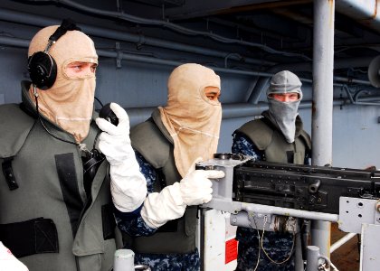 US Navy 101112-N-2218S-002 Sailors man a .50 caliber gun mount during a training exercise aboard the forward deployed amphibious assault ship USS E