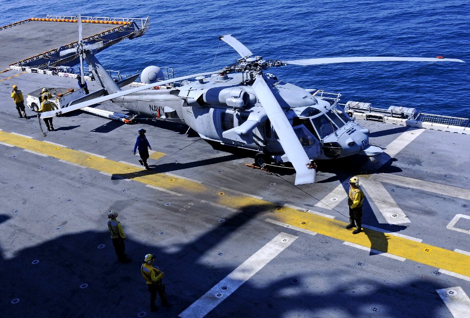US Navy 101116-N-3154P-030 Sailors prepare an MH-60S Sea Hawk helicopter assigned to Helicopter Sea Combat Squadron (HSC) 22 for flight operations