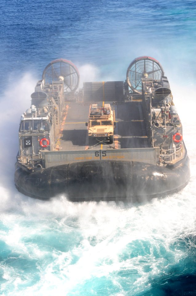 US Navy 101111-N-3659B-013 A landing craft air cushion assigned to Assault Craft Unit (ACU) 5 departs the well deck of the amphibious assault ship