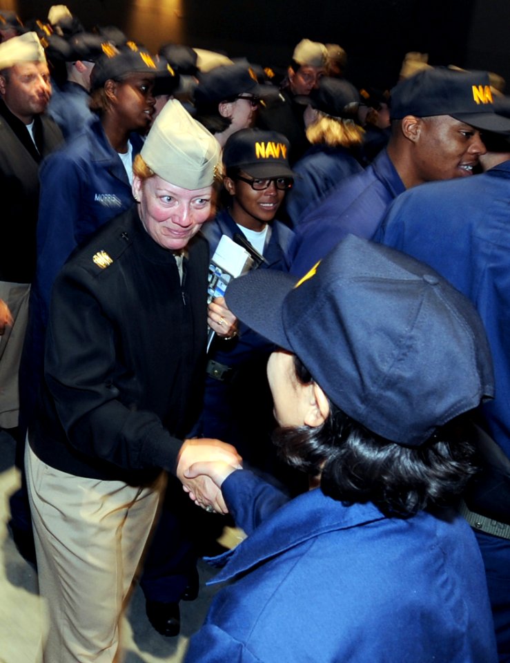 US Navy 101117-N-8848T-910 Third Fleet Command Master Chief JoAnn Ortloff congratulates a recruit after a capping ceremony at Recruit Training Comm