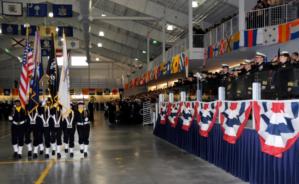 US Navy 101112-N-8848T-516 A Navy recruit color guard marches past the reviewing stand during a pass-in-review graduation ceremony at Recruit Train