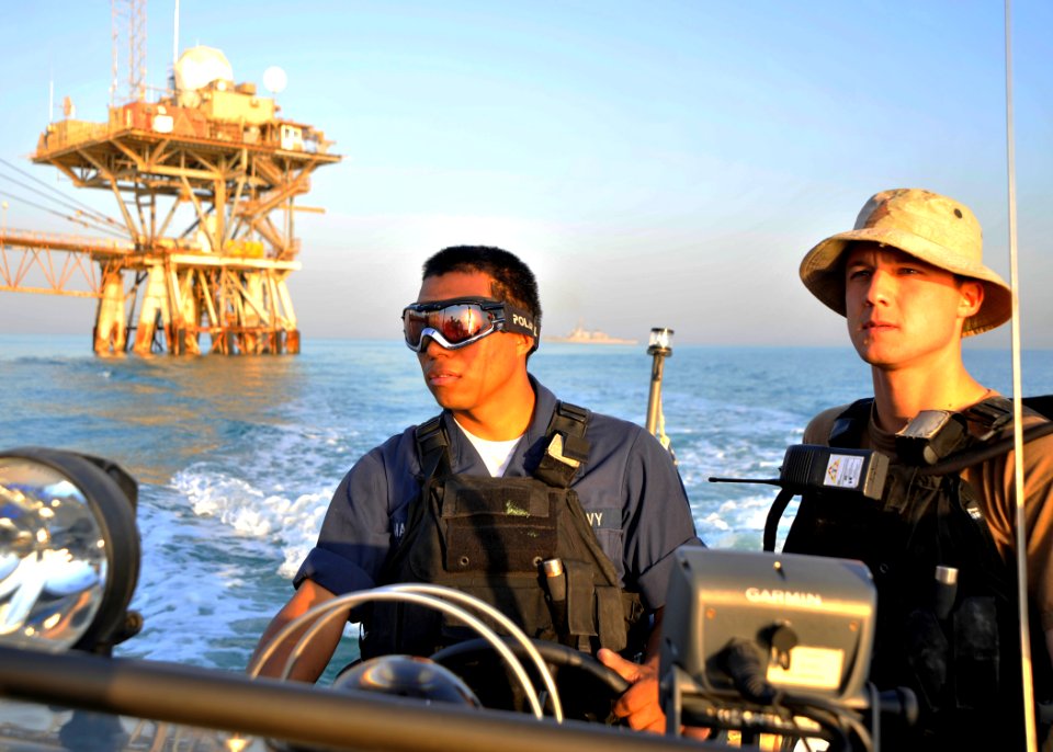 US Navy 101114-N-6499D-265 Boatswain's Mate Seaman Roberto Martinez and Ensign Daniel Deutsch assigned to the guided-missile destroyer USS O'Kane (