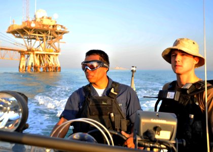 US Navy 101114-N-6499D-265 Boatswain's Mate Seaman Roberto Martinez and Ensign Daniel Deutsch assigned to the guided-missile destroyer USS O'Kane (