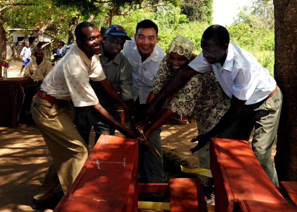 US Navy 101117-N-7241L-006 U.S. Navy Lt. Perry Choi, center, team leader for Maritime Civil Affairs Team (MCAT) 205, and educational and community