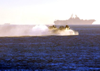 US Navy 101115-N-1722W-201 Landing Craft Air Cushion (LCAC) 76, from Assault Craft Unit (ACU) 5, returns to the amphibious assault ship USS Boxer (