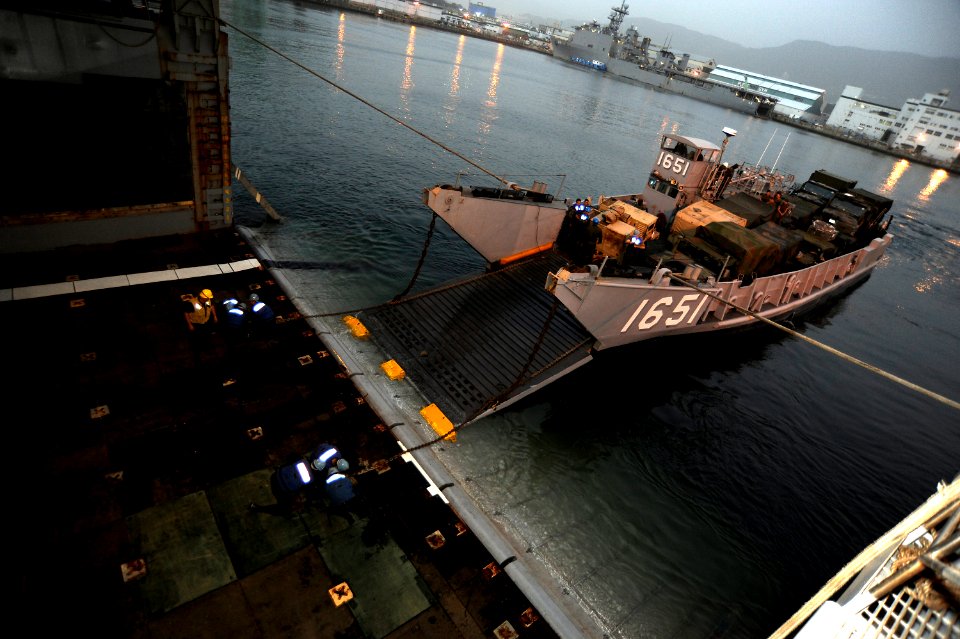 US Navy 101112-N-8335D-528 Sailors secure Landing Craft Utility (LCU) 1651 to the stern gate of the amphibious dock landing ship USS Tortuga (LSD 4