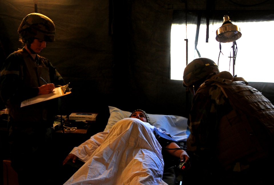 US Navy 101114-N-1786N-297 Sailors assigned to Amphibious Construction Battalion (ACB) 1 provide care to a simulated pregnant women during the ACB