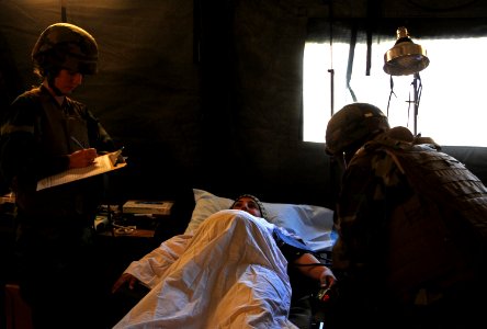 US Navy 101114-N-1786N-297 Sailors assigned to Amphibious Construction Battalion (ACB) 1 provide care to a simulated pregnant women during the ACB