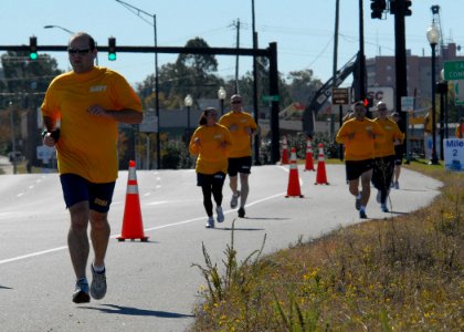 US Navy 101113-N-3737T-122 Sailors from the guided-missile destroyer Pre-Commissioning Unit (PCU) Gravely (DDG 107) participate in a 5 kilometer ru