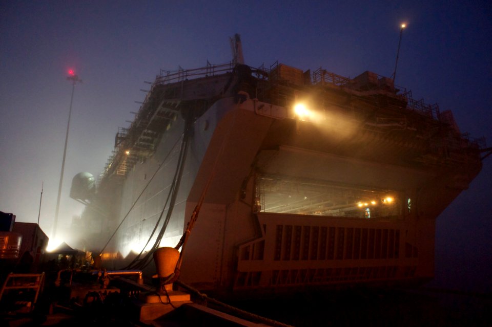 US Navy 101118-N-9643K-787 A view of the amphibious assault ship USS Bonhomme Richard (LHD 6) in early morning fog at Naval Station San Diego