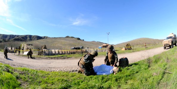 US Navy 101114-N-1786N-240 Sailors assigned to Amphibious Construction Battalion (ACB) 1 provide care to a simulated pregnant women during the ACB