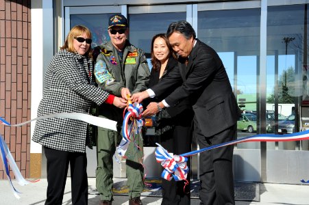 US Navy 101119-N-2858S-088 Managers of Yokohama branch of Obayashi Corporation, cut the ribbon at the grand re-opening of the NEX at Naval Air Faci