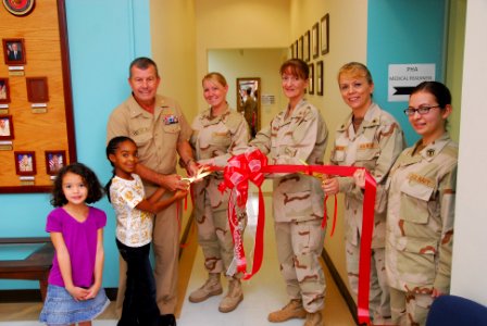 US Navy 101116-N-5821P-010 Rear Adm. Alton Stocks, commander of Naval Medical Center Portsmouth and Navy Medicine East, cuts a ribbon to open the N