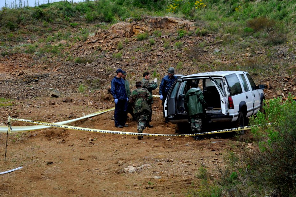 US Navy 101116-N-8546L-297 Uruguayan interagency forces collect forensic evidence after disrupting an improvised explosive device during a training