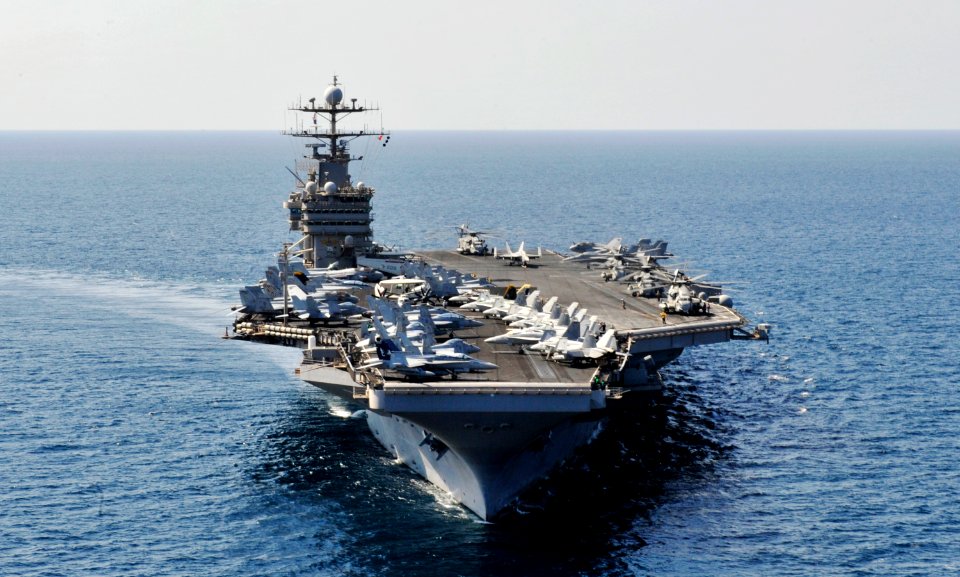 US Navy 101115-N-6003P-333 The aircraft carrier USS Harry S. Truman (CVN 75) refuels four CH-53E Super Stallion helicopters, right, assigned to the