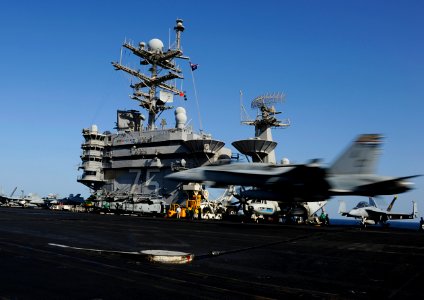US Navy 101116-N-6427M-071 An F-A-18C Hornet assigned to the Checkerboards of Marine Fighter Attack Squadron (VMFA) 312, approaches the flight deck